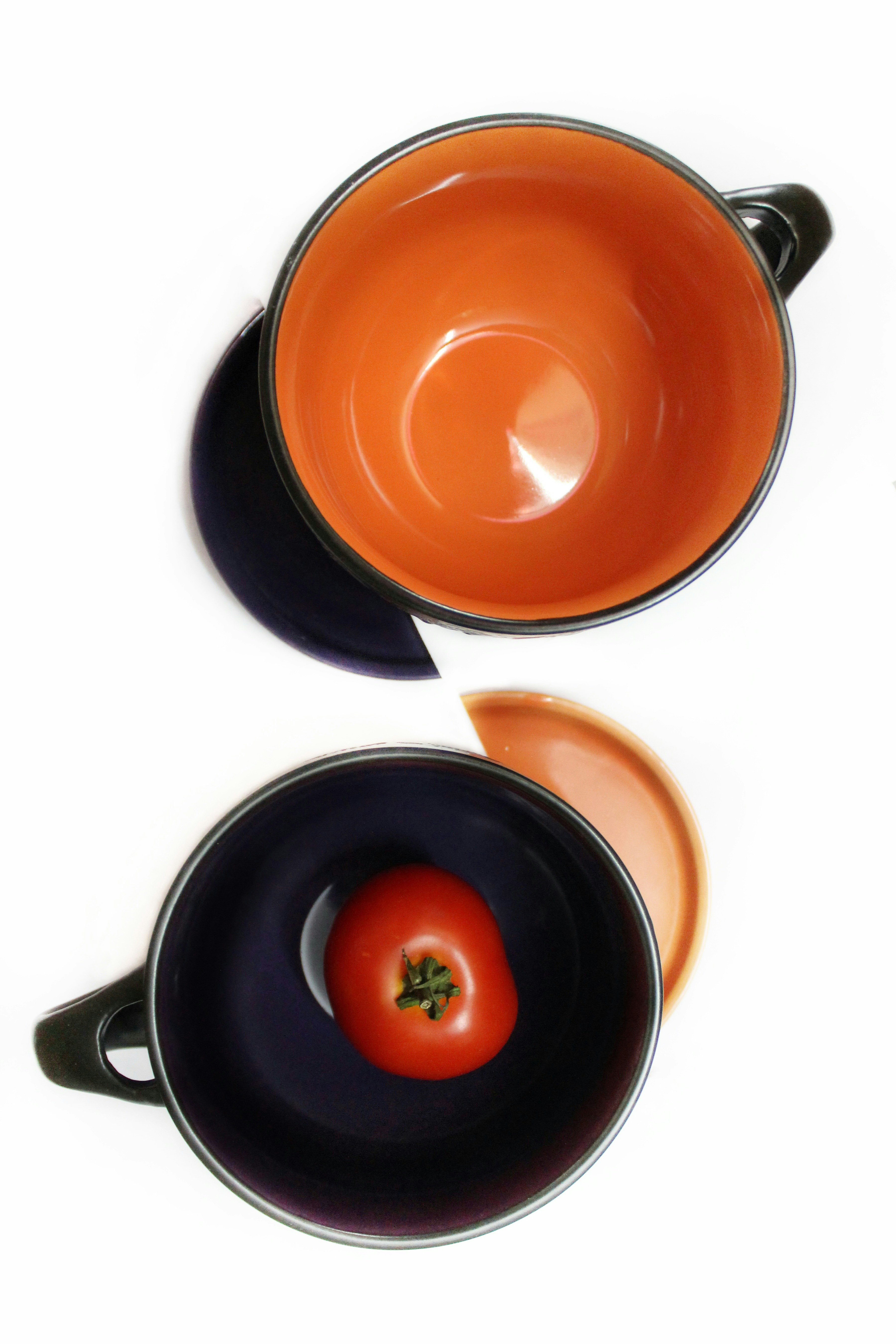 orange and black ceramic mug